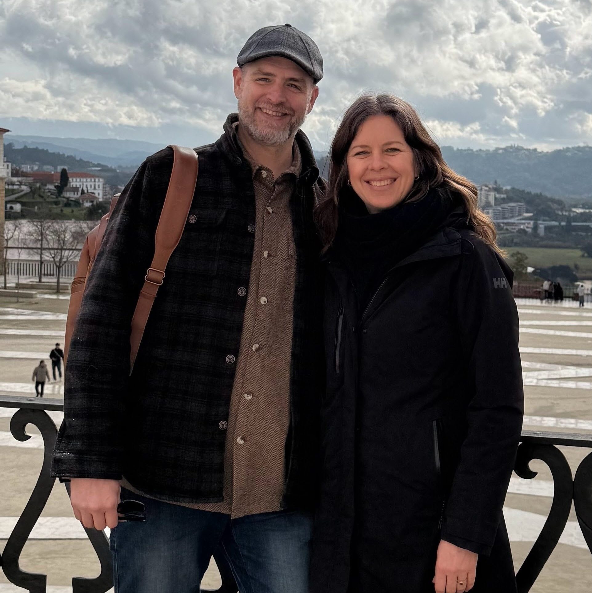 John Dykhuis-Deely and Brooke Dykhuis-Deely posed with a scenic background